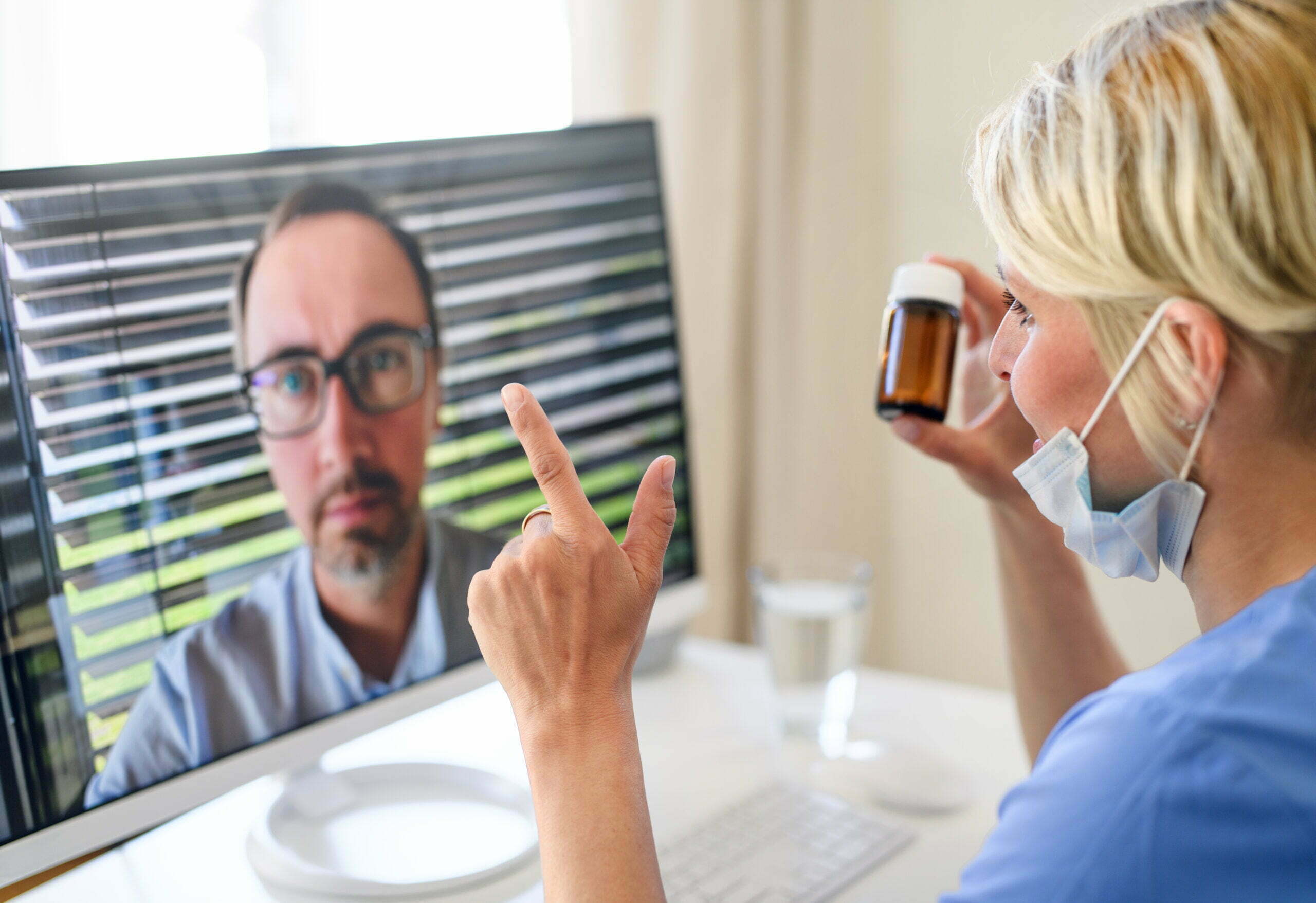 doctor using remote patient monitoring with patient
