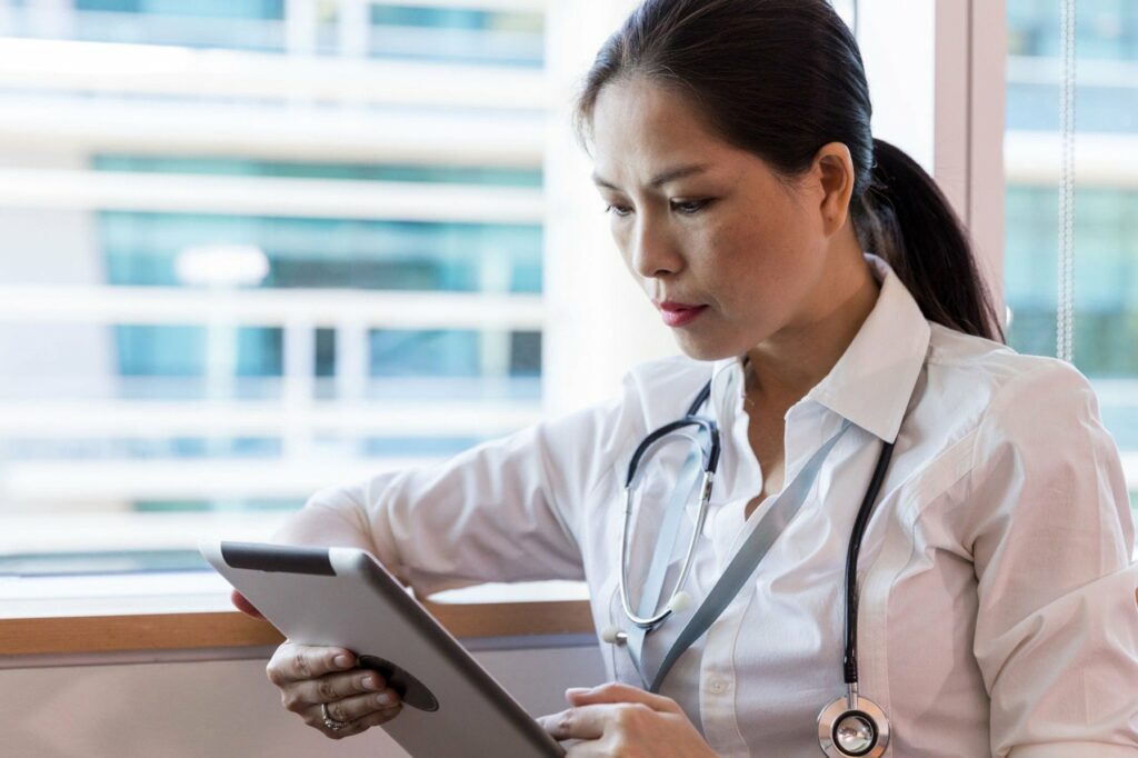 doctor assessing insurance coverage