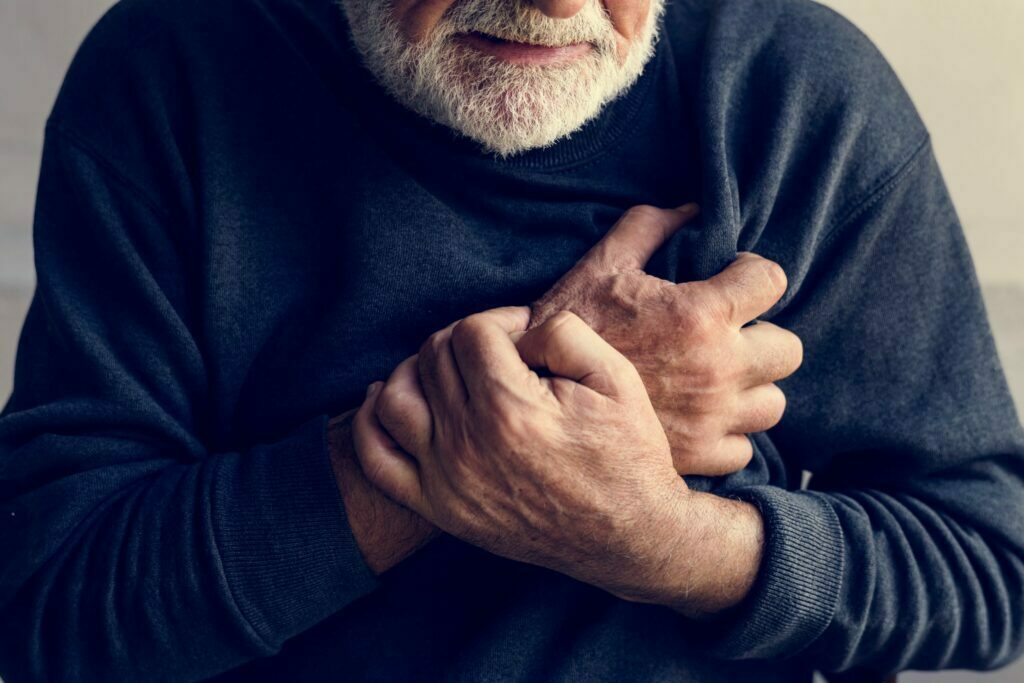 elderly man having a heart attack
