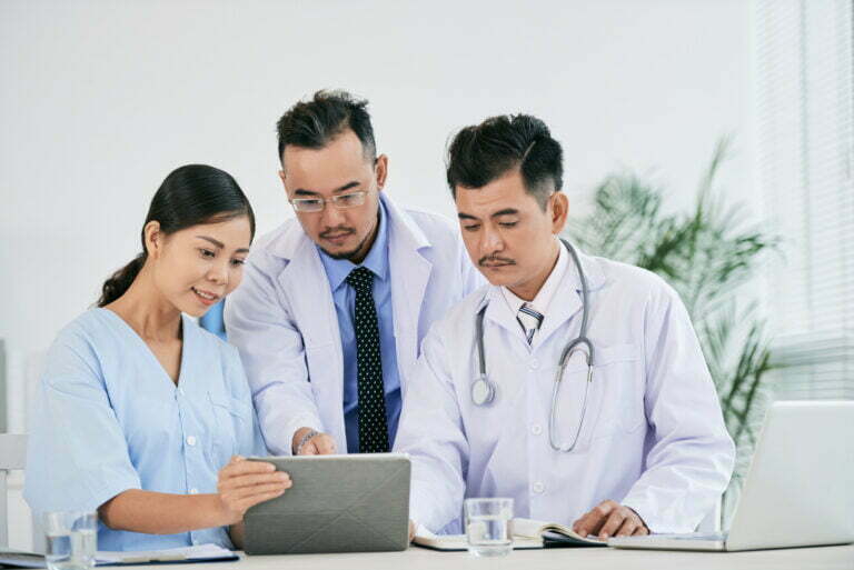nurse and doctors checking fusion of data nurse and doctors checking fusion of data
