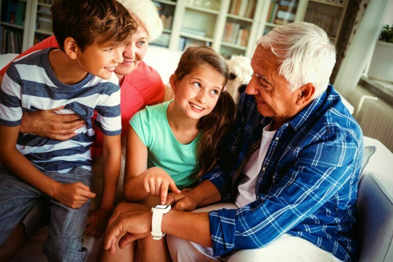 grandparents and grandchildren using smartwatch grandparents and grandchildren using smartwatch