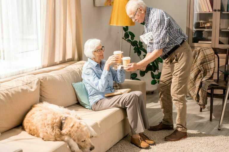 senior couple drinking coffee with sweeteners