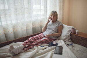 old woman using remote patient monitoring transforming healthcare
