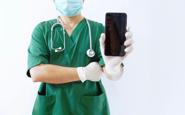 doctor using smartphone as one of health technologies doctor using smartphone as one of health technologies