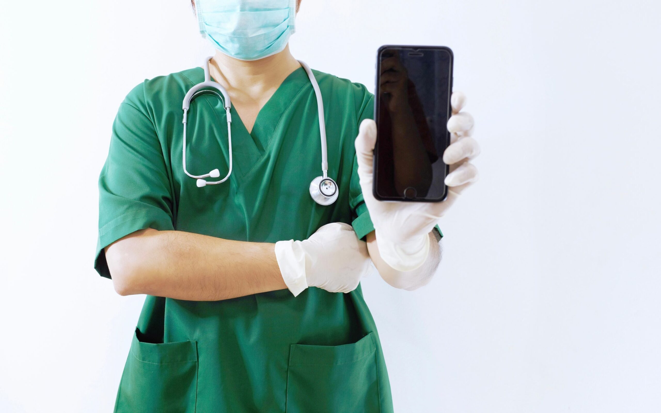 doctor using smartphone as one of health technologies doctor using smartphone as one of health technologies