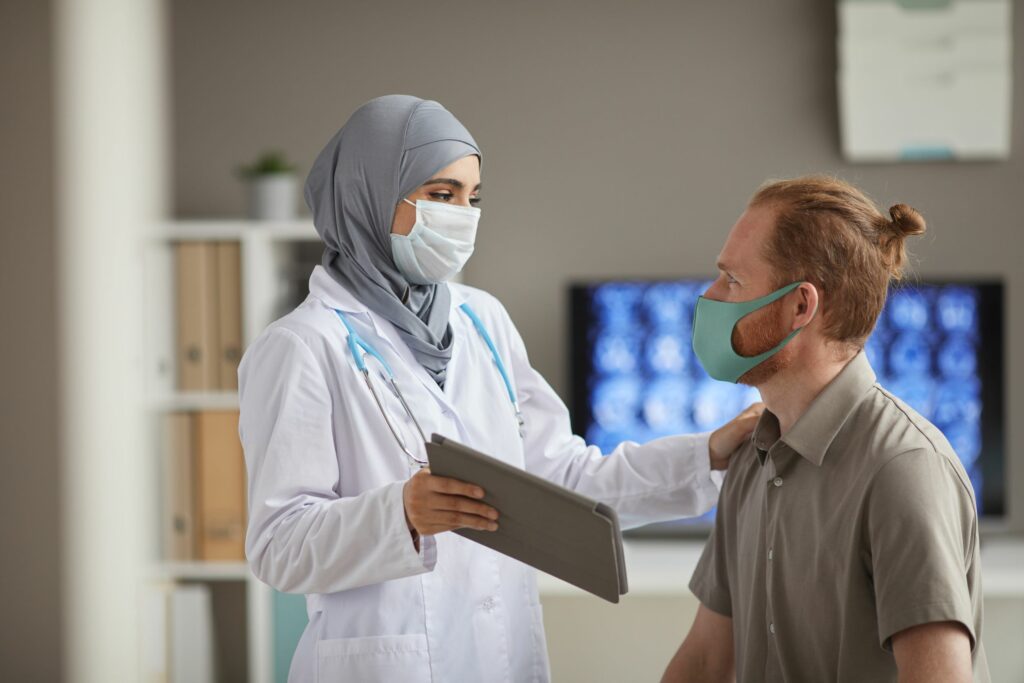 doctor talking to patient about remote patient monitoring