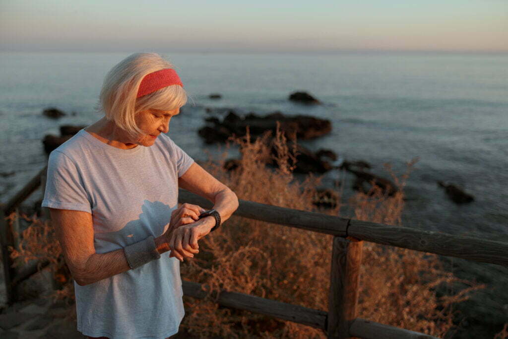woman using smartwatch for remote care