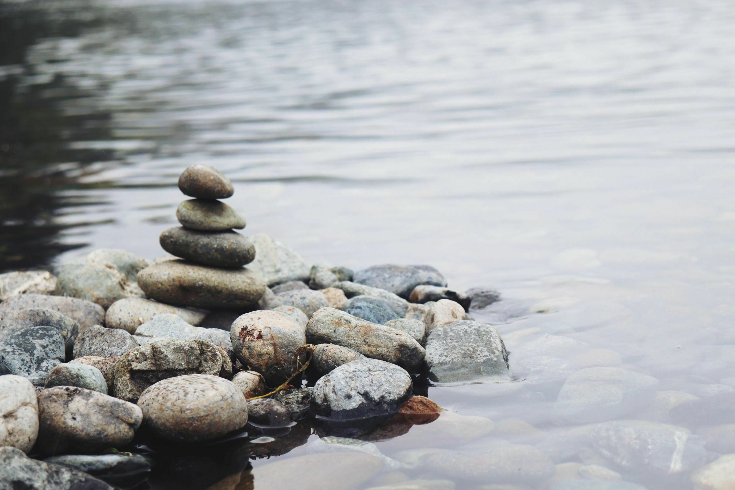 stacked rocks in water meditation stacked rocks in water meditation