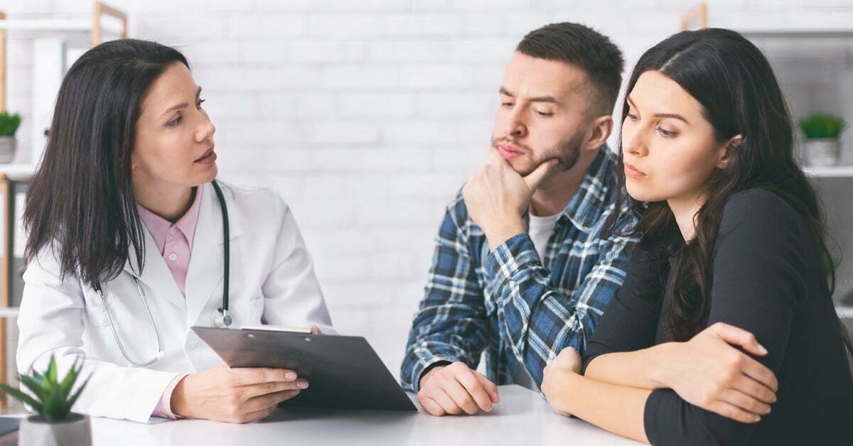 couple reading doctor prescription for infertility cure
