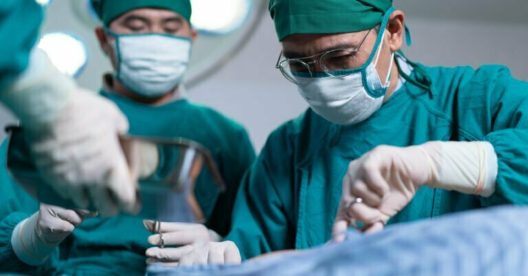 medical team perform surgical operation in operating room