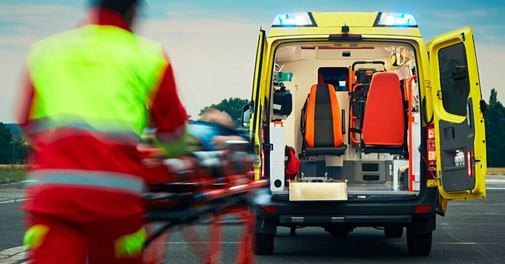 emergency medical service, paramedic with patient to the ambulance car