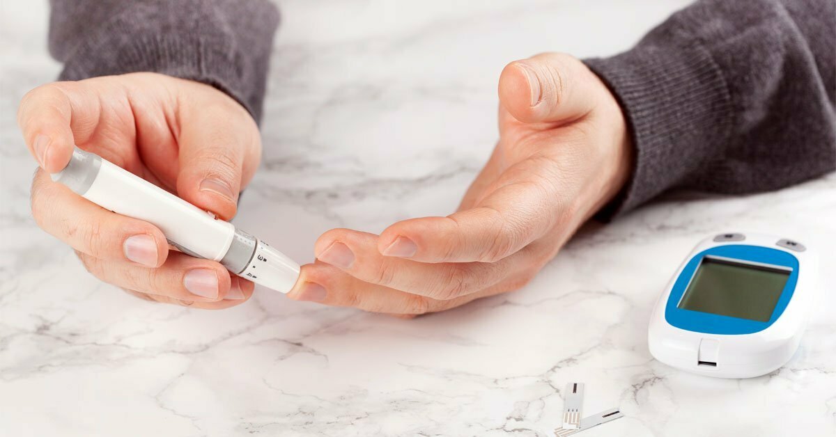 man checking blood sugar for diabetes foot care man checking blood sugar for diabetes foot care