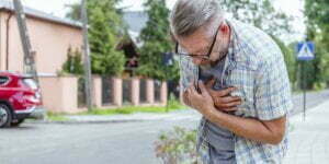 midde age man having heart attack on the street