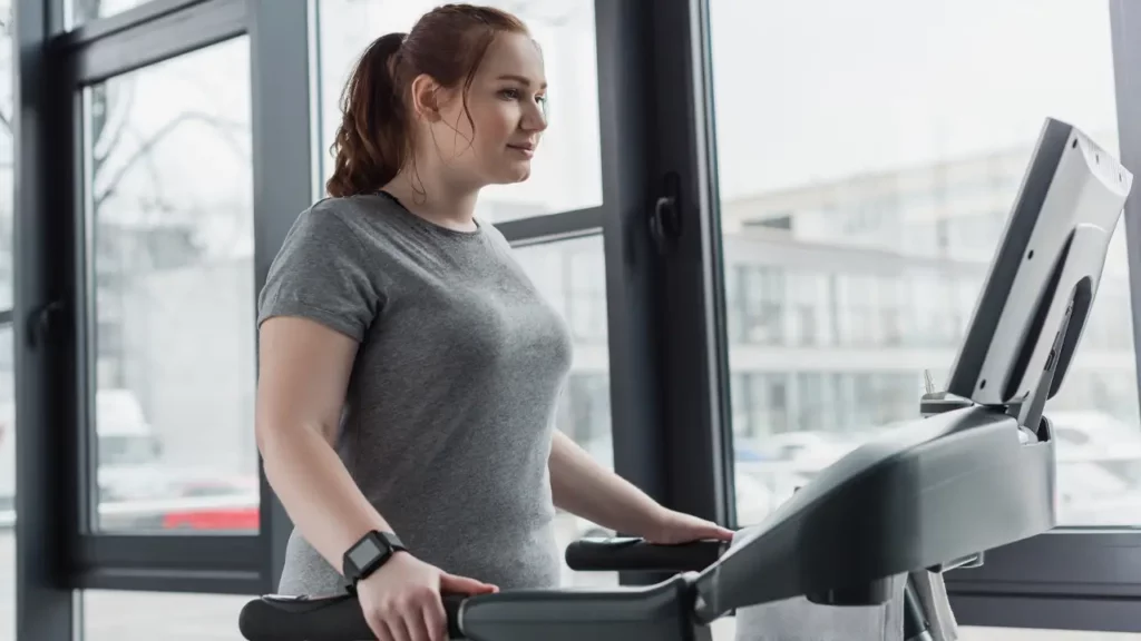 girl running on treadmill to overcome obesity epidemic