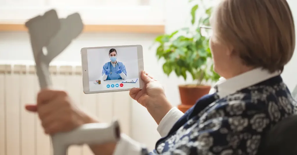 woman holding tablet for telehealth home monitoring