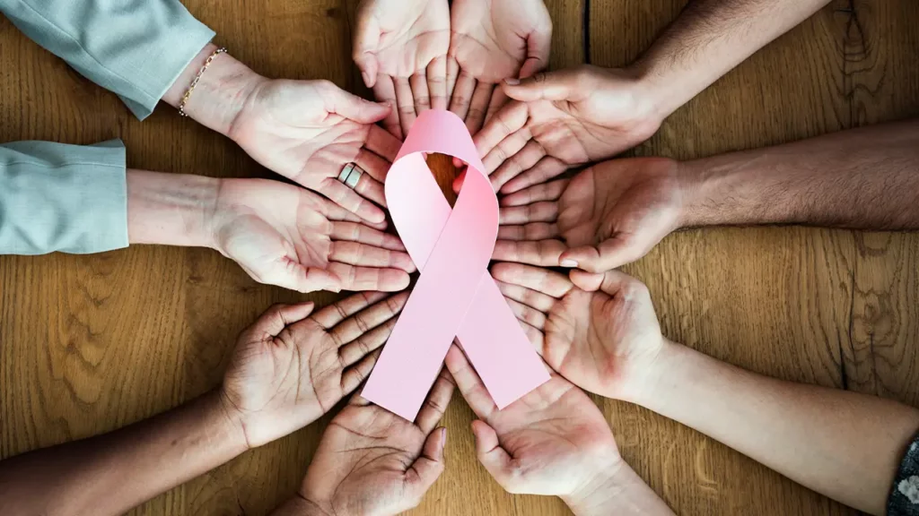 can men get breast cancer hands holding pink ribbon
