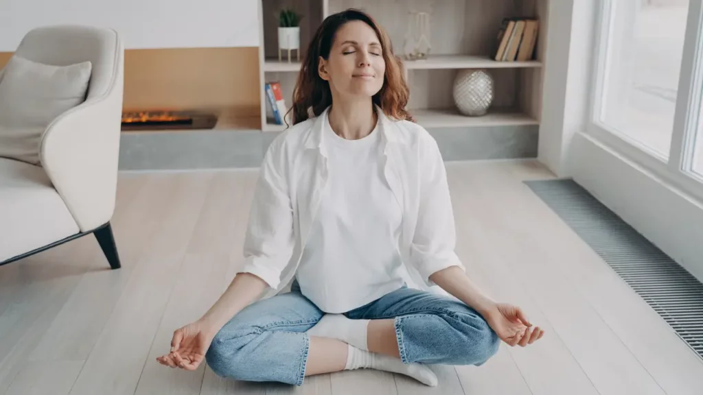 stress awareness woman practicing meditation on floor