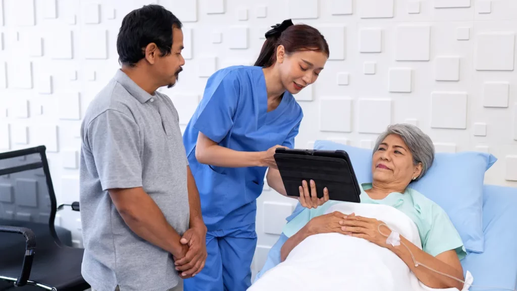 nurse discussing medical results to patient using a tablet