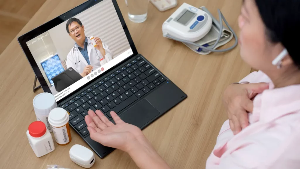 telehealth doctor and patient online visit using computer at home