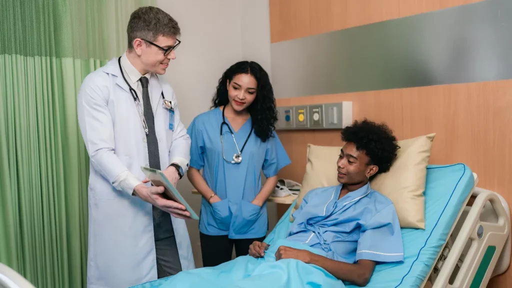 doctor and patient in hospital ward