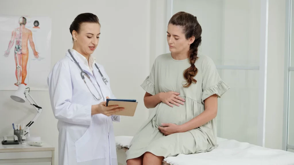 gynecologist and pregnant patient consultation, showing result of uv image